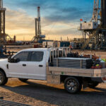Strongback Flatbed delivering gear at an oil field